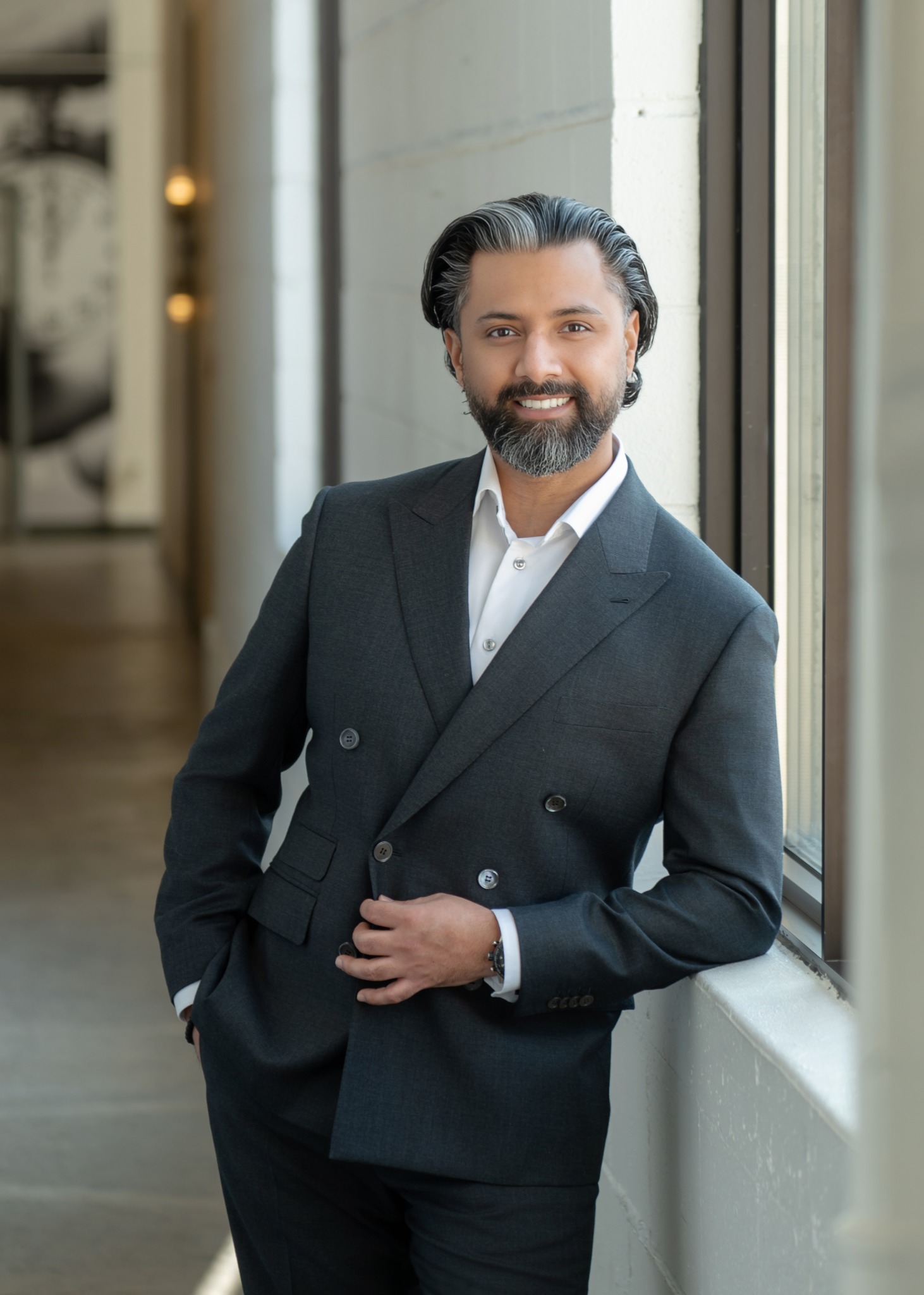 Ajit Saul in a charcoal suit