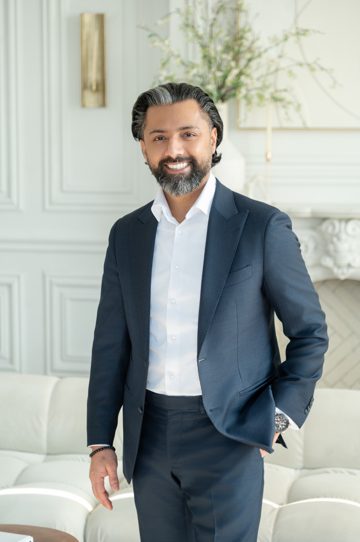 Ajit Saul in a navy business suit